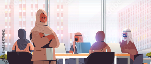 arab businesswoman leader discussing with arabic businesspeople group during conference meeting successful teamwork concept modern office interior horizontal portrait vector illustration