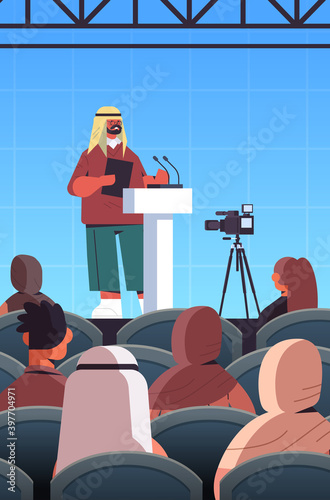 arab male doctor giving speech at tribune with microphone medical conference meeting medicine healthcare concept lecture hall interior vertical vector illustration
