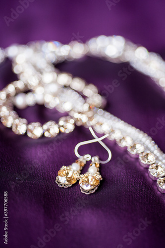 wedding jewelry on purple dress