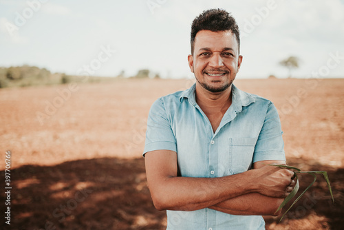 latin american farmer with arms crossed