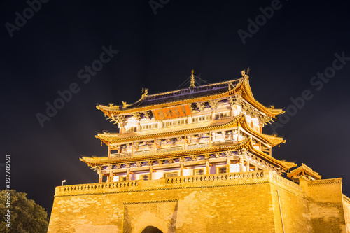 ancient weiyuan tower closeup at night photo