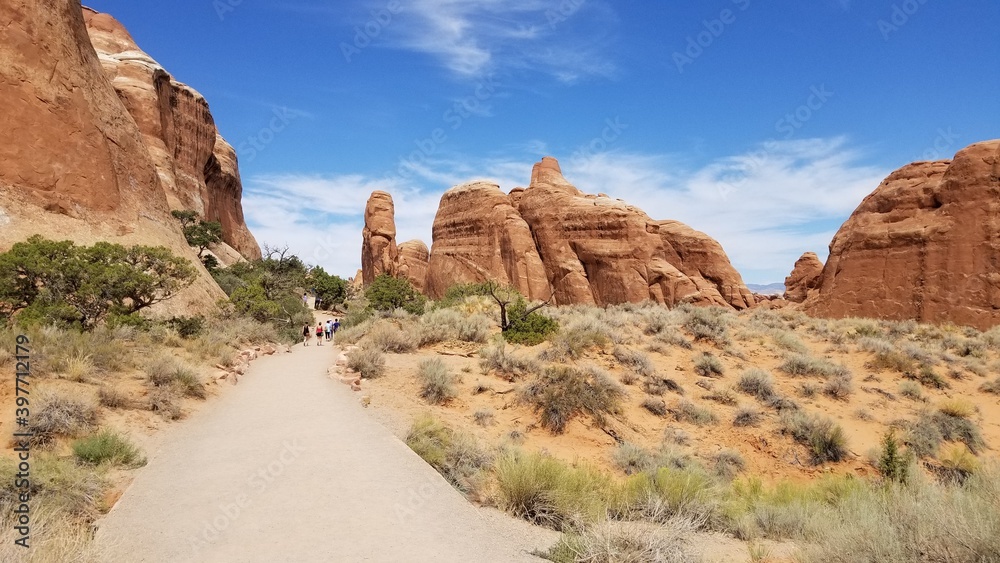 Hikers on the Devil's Garden hiking trail, Arches National Park Hikers on the Devil's Garden hiking trail, Arches National Park