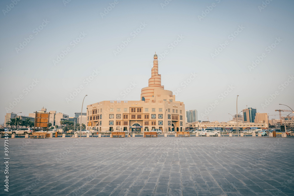 Empty square and Abdullah Bin Zaid Al Mahmoud Islamic Cultural Center (Fanar), a famous travel destination with modern Islamic building design in Doha city center
