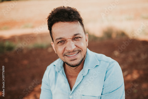 Smiling Latino farmer, close-up portrait