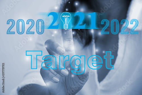 woman press the button of 2020 Target on virtual screen.