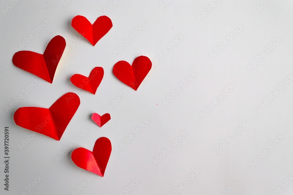 festive valentine's day background. Red hearts on a white background. Place for your text festive valentine's day background. Red hearts on a white background. Place for your text