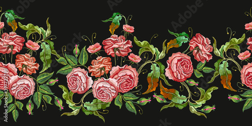 Embroidery buds of red roses on black background. Horizontal seamless pattern. Fashionable template for design of clothes, t-shirt design, tapestry flowers renaissance style