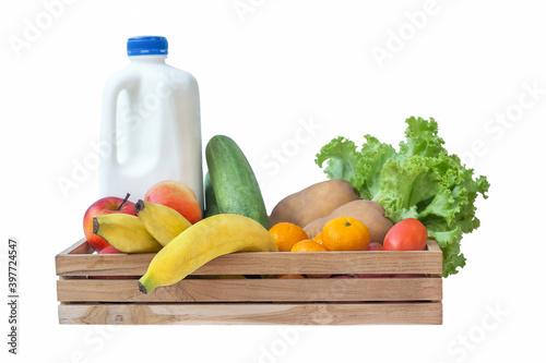food, fruits and vegetables in a wooden box. isolated