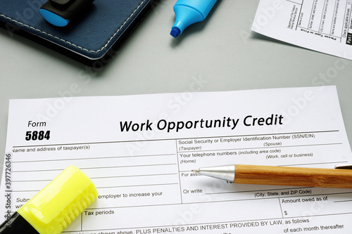 Form 5884 Work Opportunity Credit sign on the piece of paper.