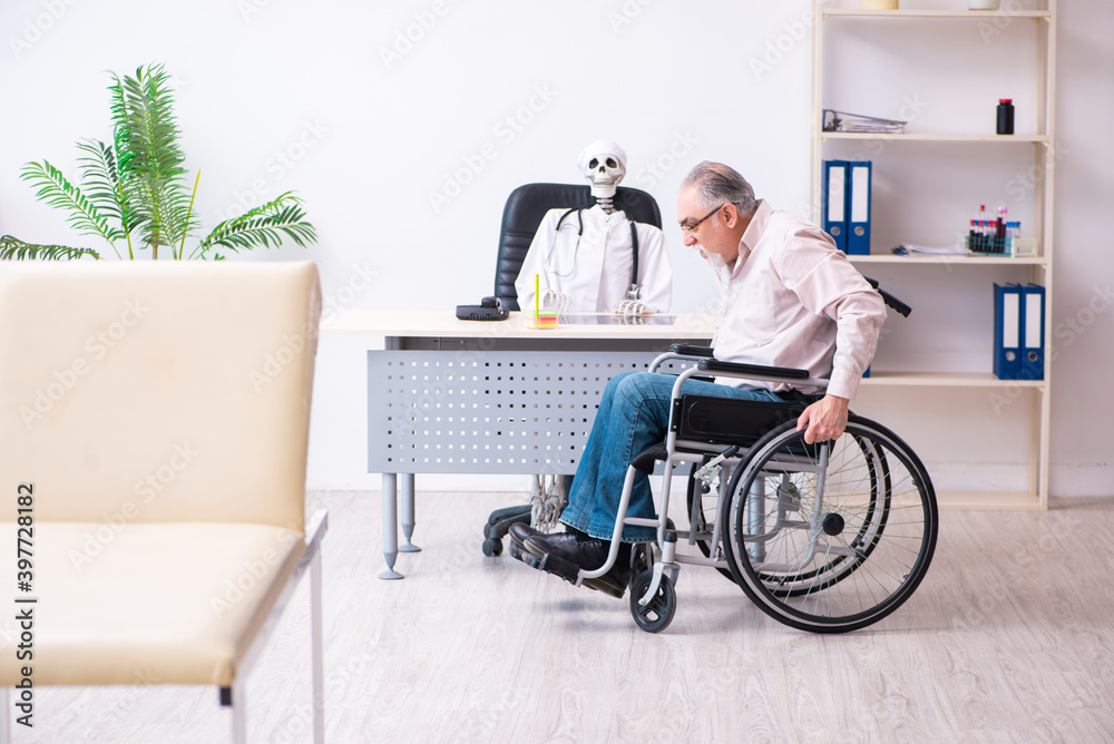 Old man in wheel-chair visiting dead doctor