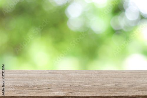 Wooden decking with space for placement of advertising materials. And has a blurred background, bokeh, can be used as a background advertising