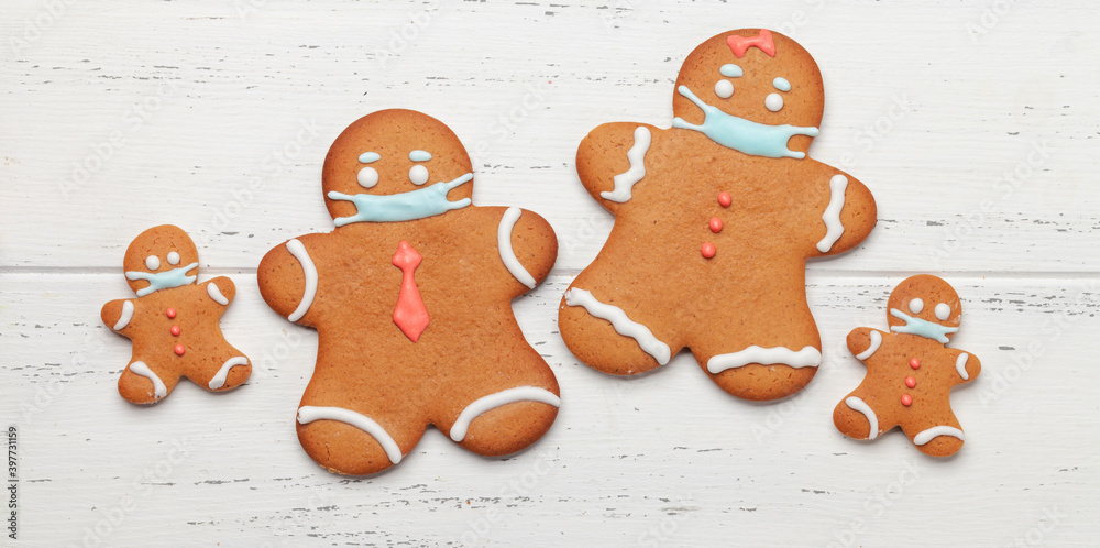 Fototapeta premium Greeting card with gingerbread cookies in face mask