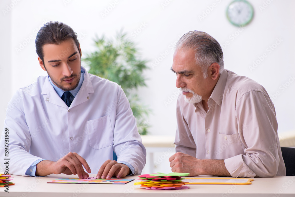 Doctor and patient suffering from Alzheimer disease Doctor and patient suffering from Alzheimer disease