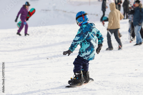 Child on a snowboard