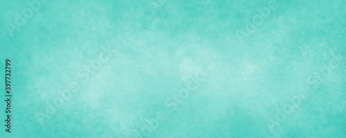 Light blue green background paper with soft grunge border texture in spring and Easter colors