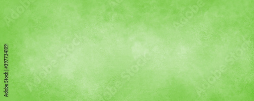 Light green background paper with soft grunge border texture for Christmas or st. Patrick's day designs, or Easter and spring colors
