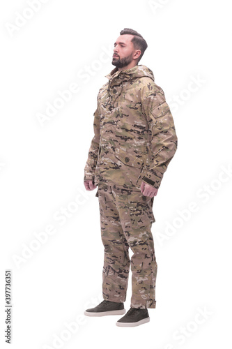 in full growth. a man in autumn camouflage . isolated on white
