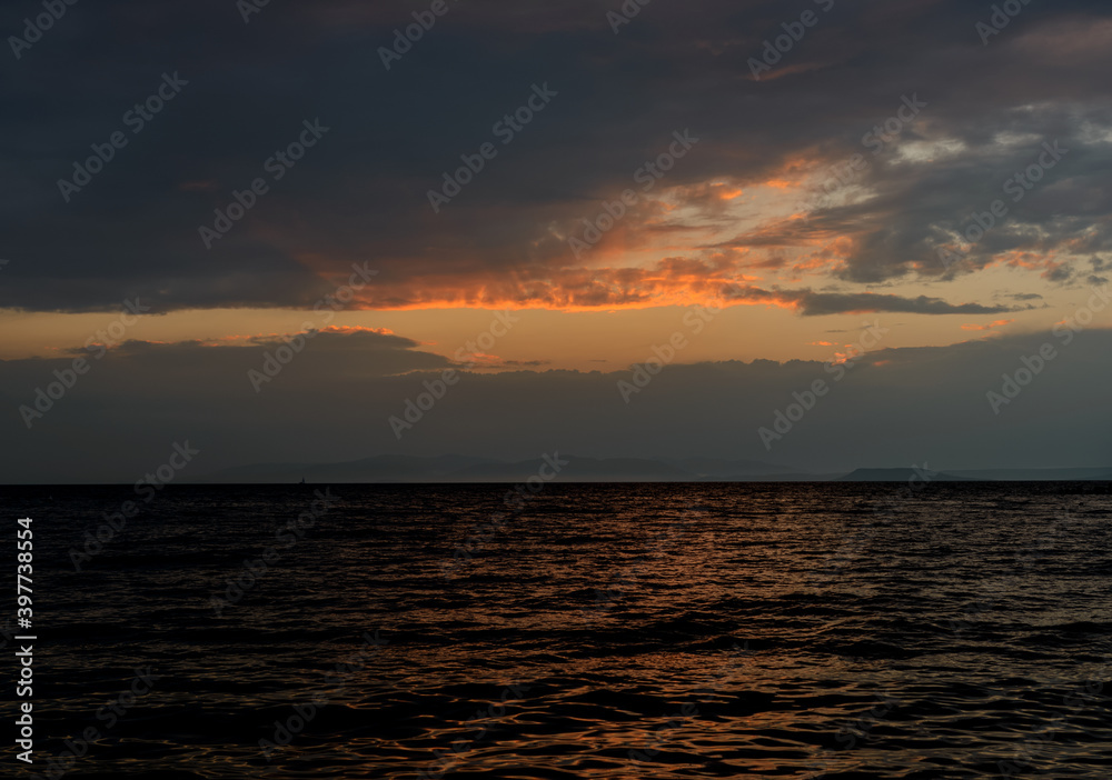 Beautiful sunset with clouds and sea.