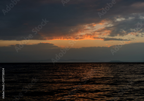 Beautiful sunset with clouds and sea.