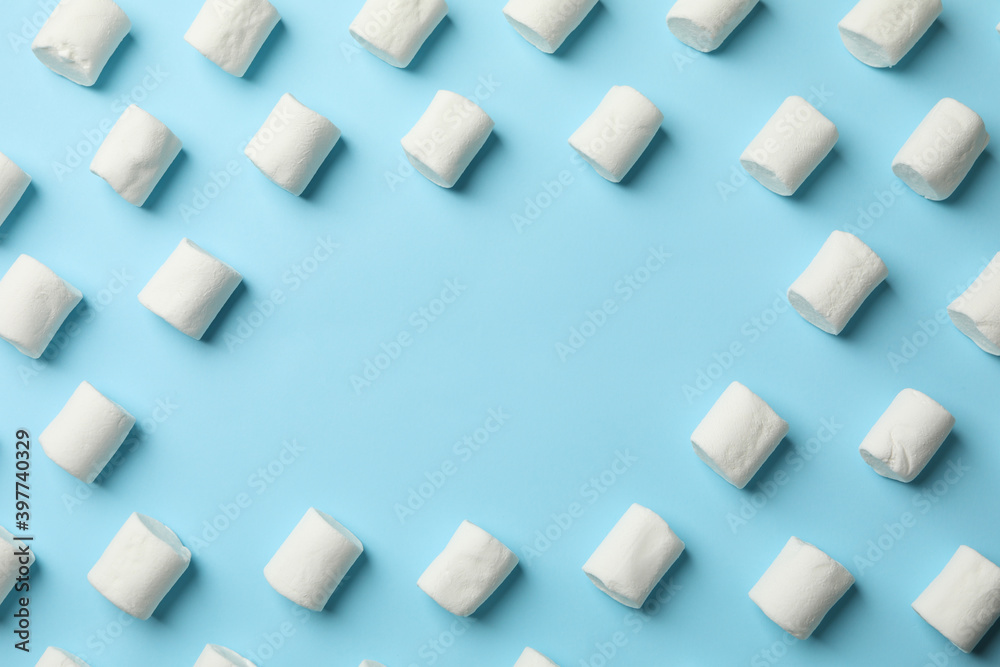 Flat lay with marshmallow on blue background Flat lay with marshmallow on blue background