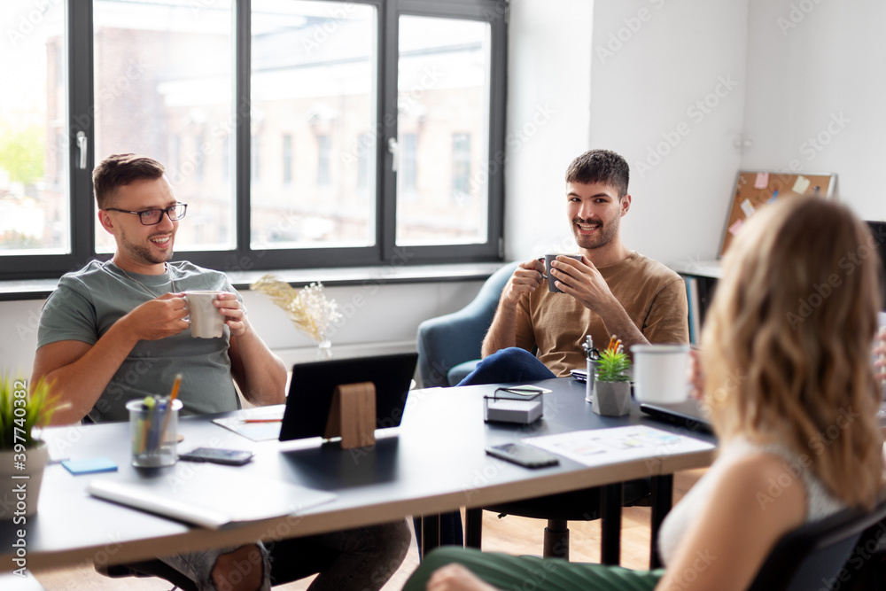 business, people and corporate concept - team of startuppers drinking coffee at office business, people and corporate concept - team of startuppers drinking coffee at office