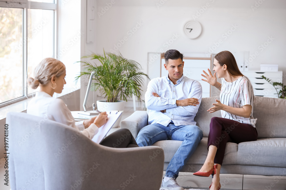 Psychologist working with young couple in office Psychologist working with young couple in office