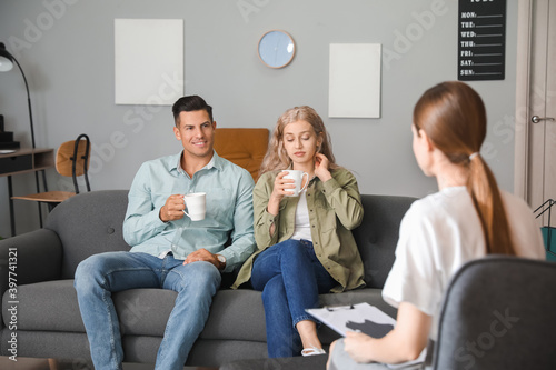 Young couple consulting wit...