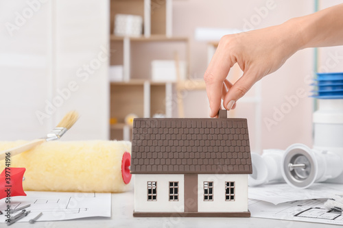 Female hand with model of n...