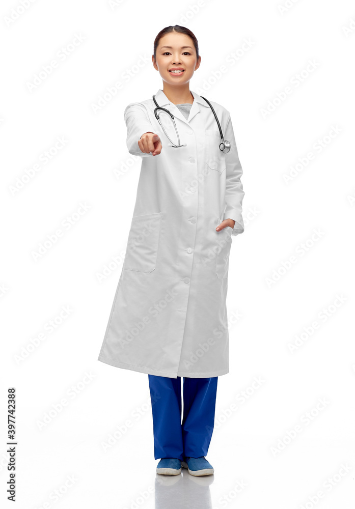 medicine, profession and healthcare concept - happy smiling asian female doctor in white coat pointing to camera medicine, profession and healthcare concept - happy smiling asian female doctor in white coat pointing to camera