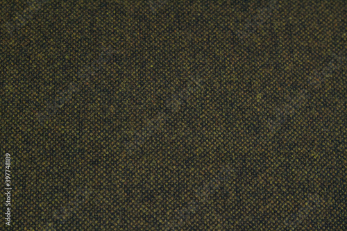 Textured background of melange brown wool fabric for warm winter clothing. Horizontal orientation
