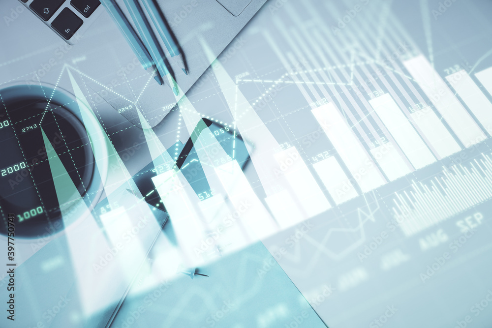 Obraz premium Double exposure of forex graph drawing over desktop background with computer. Concept of financial analysis. Top view.