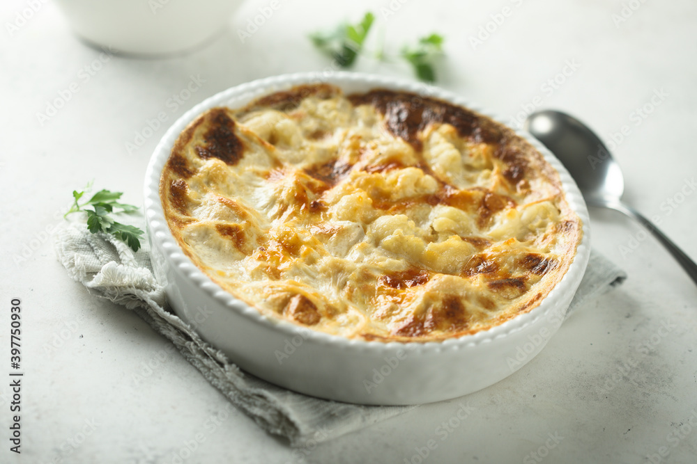Homemade cauliflower gnocchi casserole with cheese Homemade cauliflower gnocchi casserole with cheese
