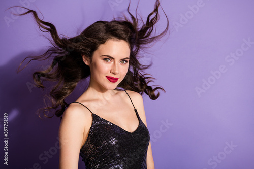 Portrait of attractive gorgeous cheery wavy-haired girl wind blowing hair glamour isolated bright violet color background © deagreez
