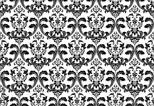Wallpaper in the style of Baroque. Seamless vector background. White and black floral ornament. Graphic pattern for fabric, wallpaper, packaging. Ornate Damask flower ornament