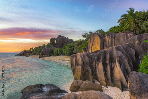 sunset at tropical beach in paradise on anse source d'argent on ladigue, seychelles