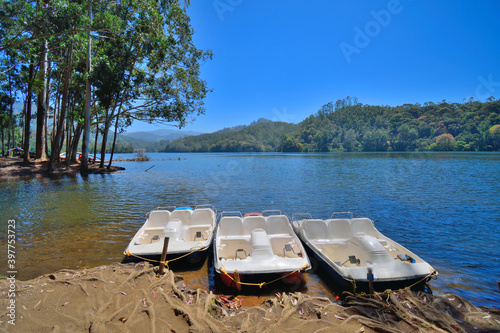 Speed boats for tourists parked in the banks of Kundala lake in Munnar, Kerala. photo