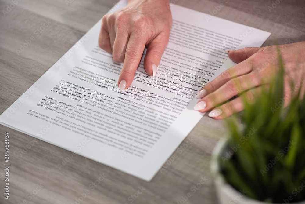 Naklejka premium Hands of woman checking document