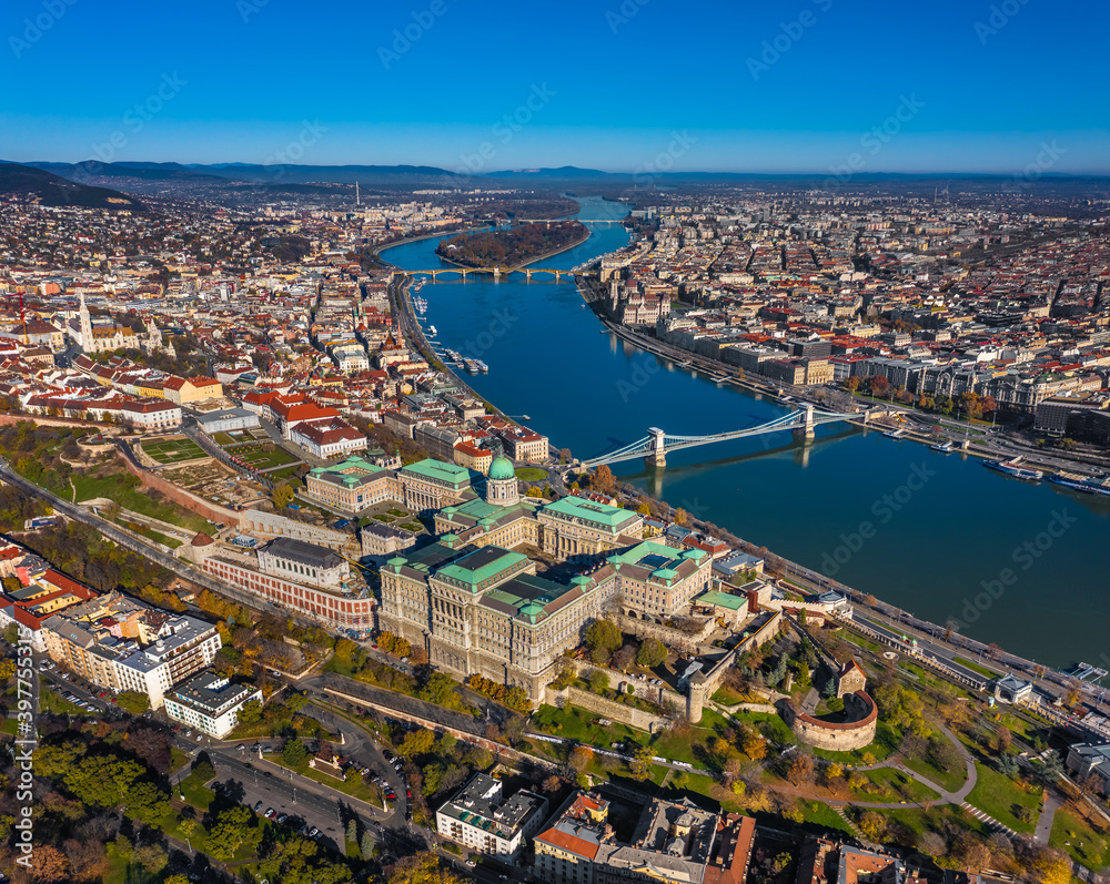 Budapest, Hungary - Aerial panoramic skyline of Budapest. Buda Castle Royal Palace, Szechenyi Chain Bridge, Parliament building, River Danube and Matthias church on a sunny autumn day with blue sky