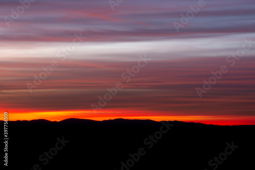  colorful sunset over the mountains © Julio García
