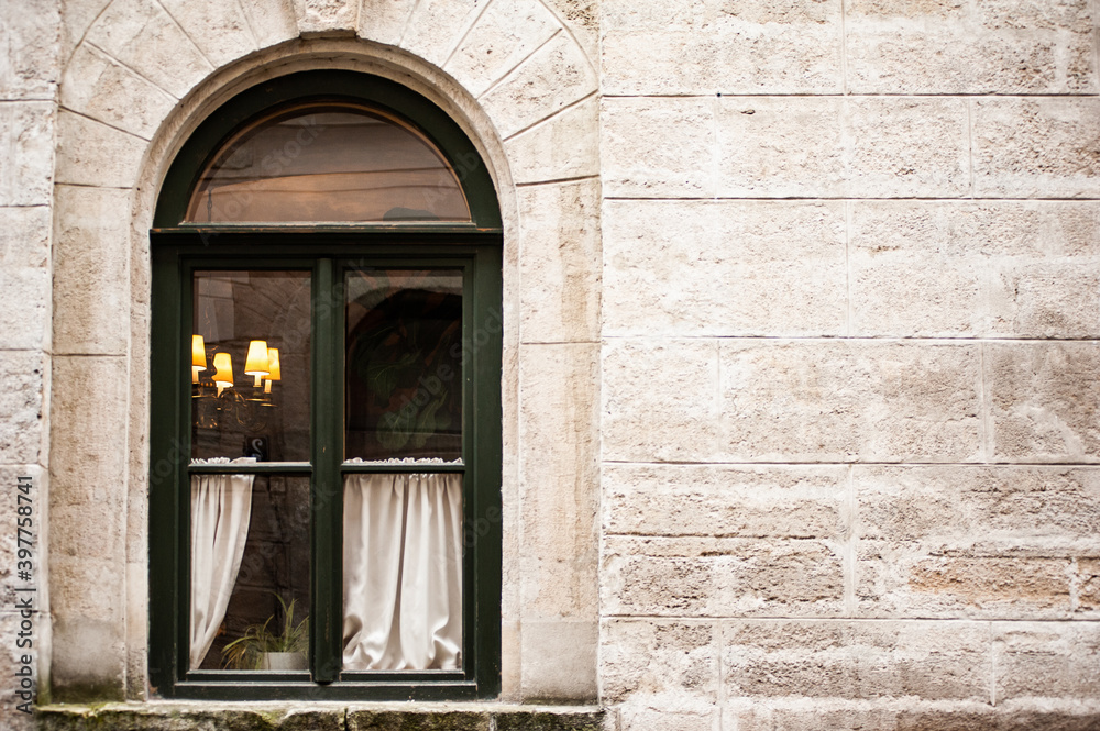Fototapeta premium Black window frame in an old European house