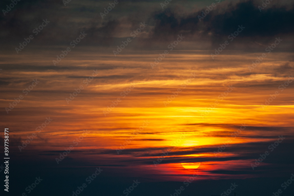 Beautiful colorful warm sunset with clouds