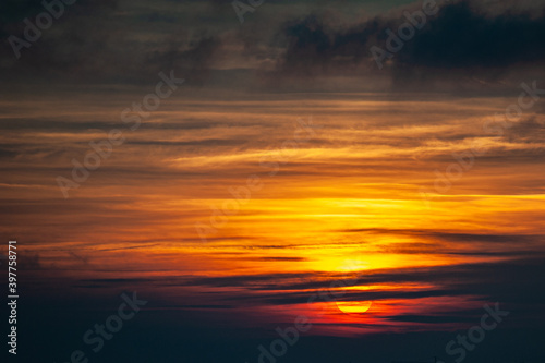 Beautiful colorful warm sunset with clouds © alipko