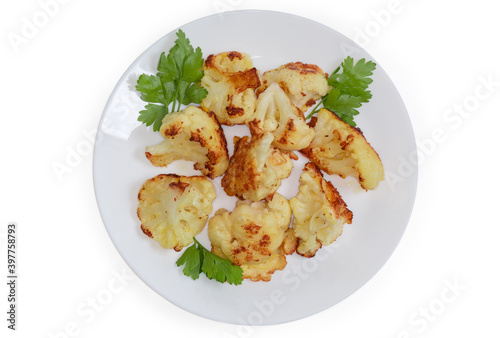 Top view of blanched cauliflower fried in batter on dish