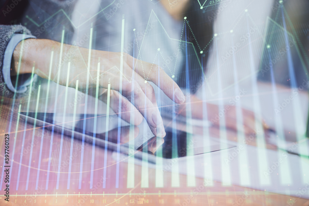 Double exposure of forex graph drawing and man and woman working together holding and using a mobile device. Trade concept. Double exposure of forex graph drawing and man and woman working together holding and using a mobile device. Trade concept.