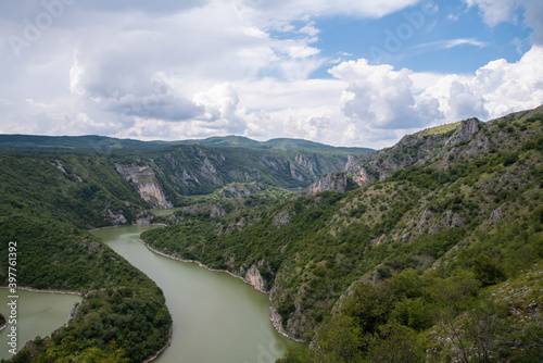 Scenic canyon view of meanders on the river Uvac  on the Zlatar Mountain with beautiful sky in the background.Uvac is a special nature reserve in Serbia with endangered bird species Griffon Vulture.