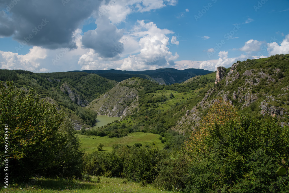 Scenic canyon view of meanders on the river Uvac, on the Zlatar Mountain,with beautiful sky in the background.Uvac is a special nature reserve in Serbia with endangered bird species Griffon Vulture.