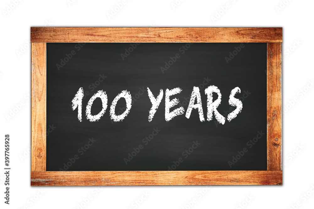 100 YEARS text written on wooden frame school blackboard. 100 YEARS text written on wooden frame school blackboard.