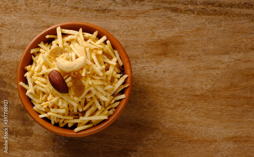 Indian style deep fried snacks falahari chivda- chivda or mixture namkeen with dry fruits.