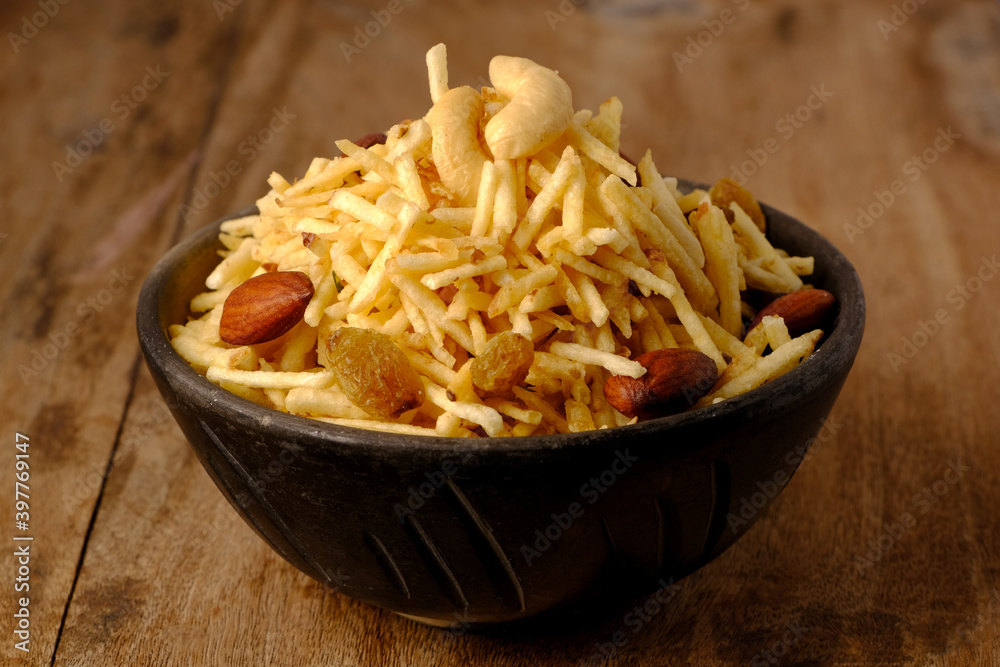 Indian style deep fried snacks falahari chivda- chivda or mixture namkeen with dry fruits.