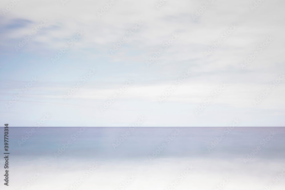 Fototapeta premium Blue ocean and shore under cloudy sky. Ocean in a bad weather. Ocean in winter 